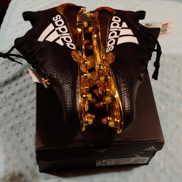 gold plated football cleats